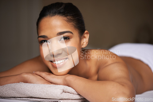 Image of Happy woman, portrait or massage in hotel to relax for zen resting or wellness physical therapy in luxury resort. Face of girl smiling in salon for body healing treatment or natural holistic detox