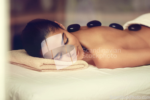 Image of Girl, rocks or back massage in spa to relax for zen resting, sleeping or wellness physical therapy hotel resort. Calm woman in salon to exfoliate for body healing treatment or hot stone detox therapy