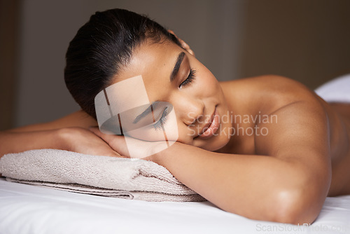 Image of Girl, sleeping or massage in hotel to relax for zen resting or wellness physical therapy in calm luxury spa. Woman with eyes closed in salon for body healing treatment or natural holistic detox care