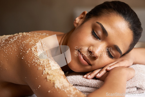 Image of Eyes closed, body scrub or back massage for woman to relax for resting or wellness physical therapy in spa. Girl client sleeping in beauty salon to exfoliate for a healthy skincare healing treatment