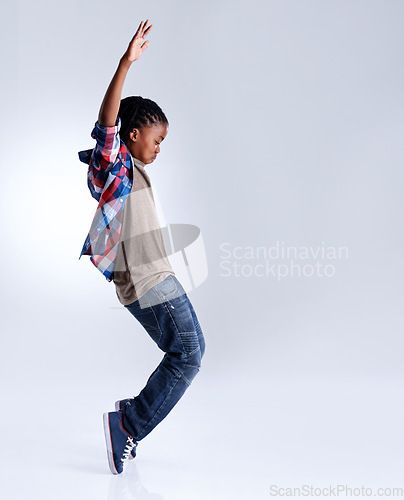 Image of Dance, hip hop and young child dancer dancing isolated in a white studio background in a pose feeling excited. Talent, mockup and kid or child with energy and skill ready for breakdance performance