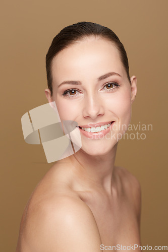 Image of Portrait, mockup and woman with cosmetics, makeup and wellness against a brown studio background. Face, female person and model with happiness, luxury and salon treatment with beauty and aesthetics