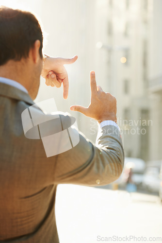 Image of Hands, frame and focus with man in city for vision, building and thinking with mockup. Inspiration, planning and idea with male employee and finger gesture for freedom, motivation and insight