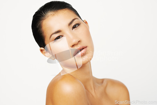 Image of Natural beauty, woman and studio portrait with skincare and dermatology with confidence. Isolated, white background and Asian female person with face makeup and skin glow from cosmetics and treatment