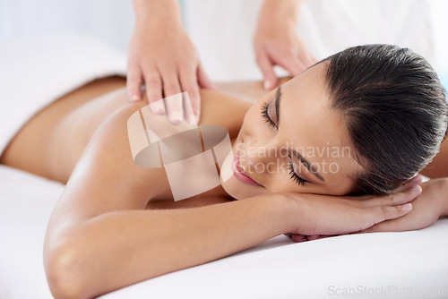 Image of Smile, spa and woman with luxury, massage and stress relief with self care, wellness and body care. Masseuse, female person a girl with skincare, grooming and holistic treatment with hands and zen