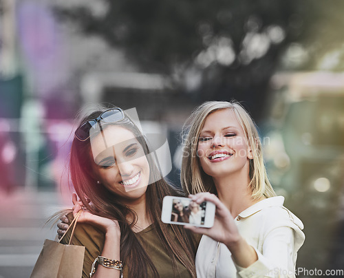 Image of Happiness, urban selfie and shopping people, friends or city women with picture memory of fashion, apparel or designer clothes. Black Friday deal, trendy boutique and person post to social media