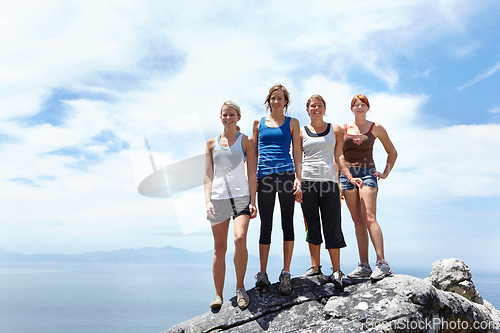 Image of Group of friends, portrait and adventure on a mountain for travel in nature. Happy female people together outdoor for sports challenge, hiking and exercise for fitness on a cliff with blue sky