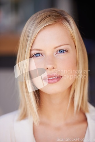 Image of Face, beauty and portrait of a woman with natural makeup, cosmetics and healthy glow on skin. Headshot of female model person from Canada with blue eyes and confidence for skincare motivation