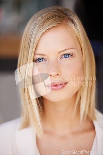 Image of Beauty, face and portrait of woman with natural makeup, cosmetics and glow on skin. Headshot of female model person from Canada with blue eyes, blonde hair and confidence for skincare wellness