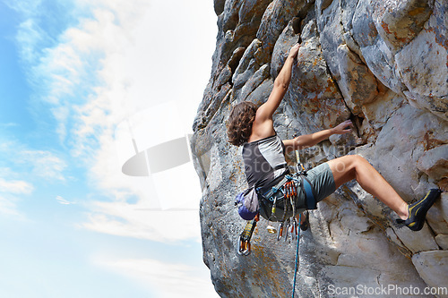 Image of Rock climbing, fitness and adventure with woman on mountain for challenge and travel with space. Strong, freedom and hiking with female climber training in nature for courage, safety and workout