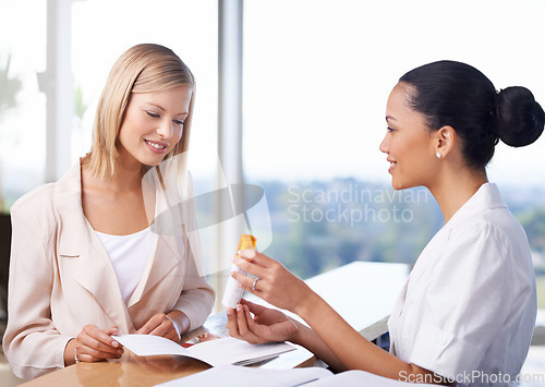 Image of Spa receptionist, woman and product for beauty, wellness or cosmetics with offer, paperwork and benefit. Women, discussion and documents for health, cosmetic and smile together at salon help desk