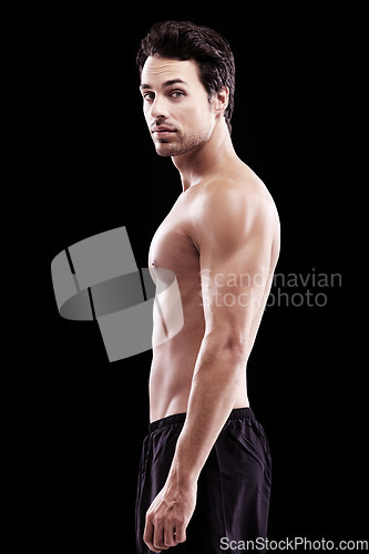 Image of Portrait, man and body of bodybuilder on black background, dark studio and muscular abdomen. Sexy, serious and strong male model, sports athlete and fitness power for exercise, training and muscle