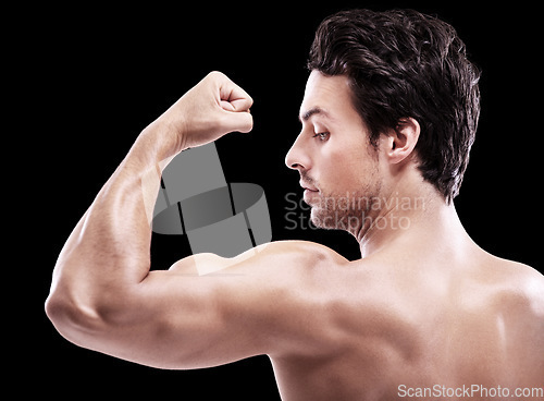 Image of Back of man, bodybuilder and bicep flex in studio, black background and exercise for power. Strong, sexy and topless male model, sports athlete and arm muscle for pride, training and fitness results
