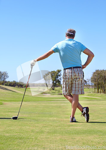 Image of Golf, rear view and old man with driver outdoor for training, hobby and sports on blue sky background. Club, behind and active senior male golfer on field for retirement fitness, match or practice