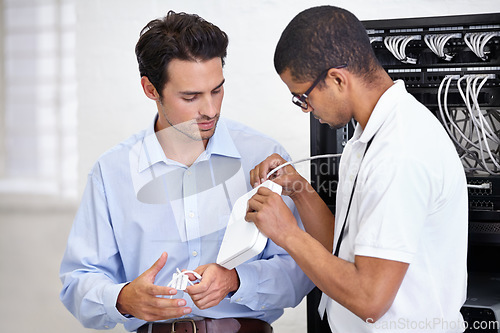 Image of Server room, modem and connection with a technician talking to a business man about cyber security. Network router, cable or wire and consulting with an engineer chatting about information technology