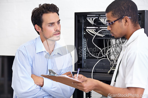 Image of Server room, men or technician with clipboard writing receipt or talking to a client about cyber security glitch. Network, database or contract with a male engineer speaking of information technology