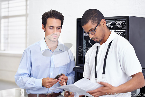 Image of Server room, it support and reading with an engineer working with a business man for cyber security. Network, database and instructions with a male technician doing research about installation