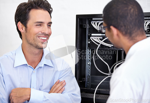 Image of Server room, it support and network with an engineer talking to a business man about cyber security. Database, consulting and maintenance with a technician chatting about information technology