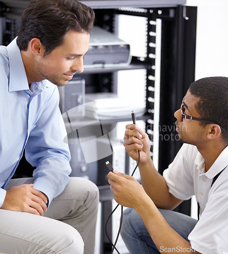 Image of Server room, it support and cables with a technician explaining to a business man about cyber security hardware. Network, database and consulting with an engineer chatting about wire management