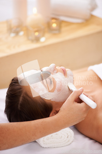 Image of Cream, spa and woman with a face mask, dermatology and treatment for acne, skincare and grooming. Female person, model and girl with a brush, creme and organic facial with wellness, beauty and health