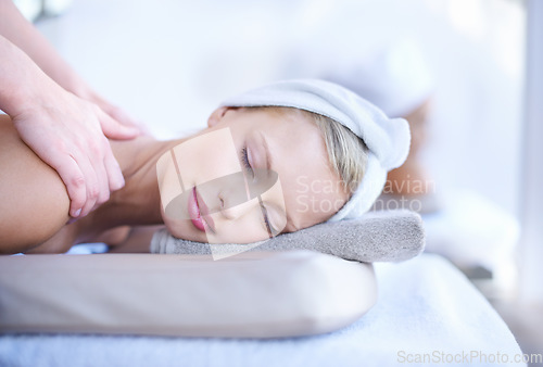 Image of Woman getting massage in spa, wellness and hands of masseuse with peace, tranquility and holistic treatment. Stress relief, zen and female person at luxury resort with self care and body healing