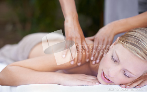 Image of Hands of masseuse, woman getting massage in spa and wellness with peace, tranquility and holistic treatment. Stress relief, zen and female person at luxury resort with self care and body healing