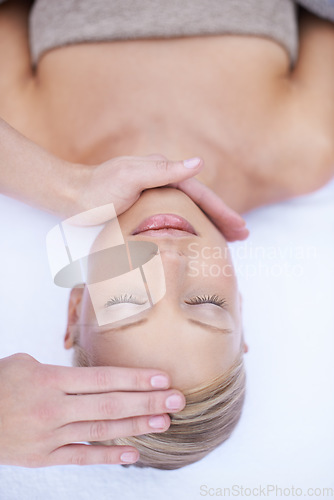 Image of Relax, reiki and facial massage, woman in spa for health, wellness and luxury treatment with eyes closed. Beauty salon, professional skin care therapist with hands on healthy face of girl from above.