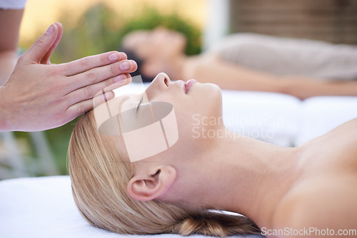 Image of Reiki, massage and face of woman at beauty salon for health, wellness and luxury skincare treatment. Relax at spa, professional skin care and facial acupressure, healing for girl in cosmetic therapy.