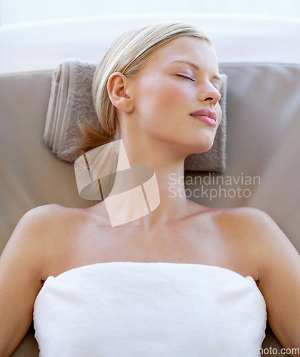 Image of Spa salon, relax and face of a woman for beauty, wellness or skincare from above. Female client sleeping on massage table for peace with luxury facial cosmetic, zen treatment and healing or health