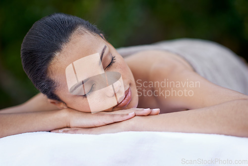 Image of Sleep, massage and a woman on a spa bed for stress relief, luxury relaxation and wellbeing in nature. Relax, calm and a young lady sleeping after a skin treatment, pampering and wellness in a garden