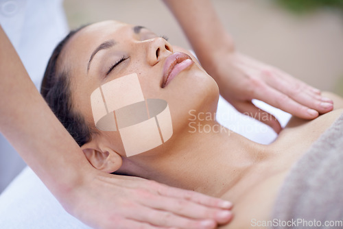 Image of Spa, relax and woman for a massage with therapist hands on body for wellness and health. Face of a calm female client or customer on a table for peace, physical therapy and luxury zen treatment