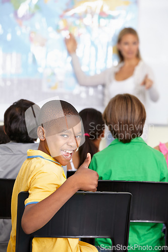 Image of Black child, portrait and thumbs up of student in class, elementary school or classroom. Funny, education and kid with hand gesture for like emoji, agreement or learning, success and approval sign.