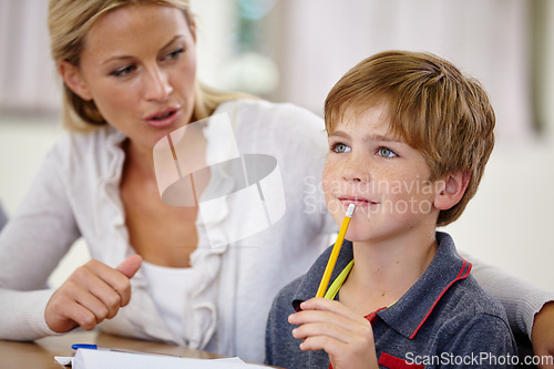 Image of School, woman helping student with homework or question and in classroom. Education or learning, female teacher assisting male child and boy with pencil at mouth for thinking or find solution.