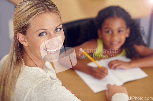 Image of Portrait, woman and kid to learn for reading on desk in the classroom for studying. Teacher, smile and child learning for student with education at school to study with support or writing on a table.