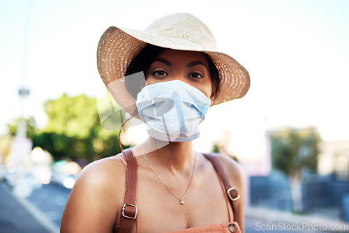 Image of Covid, portrait and woman in travel with face mask for health and on city background. Compliance, safety for wellness and female person outdoors with facial protection for corona virus pandemic