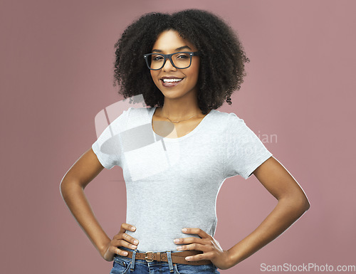 Image of Portrait, happy and black woman with glasses akimbo in studio isolated on a pink background. Natural beauty, nerd and face of African female model from Nigeria with confidence, cosmetics and fashion.