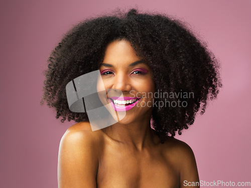 Image of Face, hair care and smile of black woman with makeup in studio isolated on a pink background for skincare. Beauty portrait, lipstick cosmetics and African female model with salon treatment for afro.