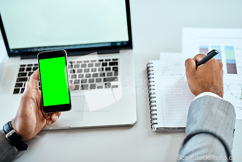 Image of Phone, green screen and man hands writing notes, ideas and laptop planning for mobile app mockup and business website. Multimedia, computer and person with smartphone mock up, notebook and research