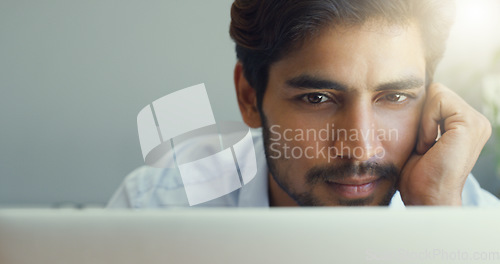Image of Mockup, business and man with a laptop, focus and thinking with ideas, inspiration and online reading. Male person, freelancer and employee with concentration, motivation and calm with technology