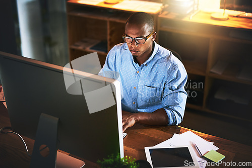 Image of Business man, night developer and computer with office typing and project web research. African male worker, technology and coding for online website management for company with tech and internet