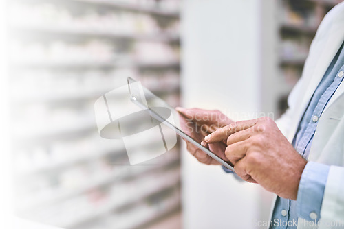 Image of Man, hands and tablet at pharmacy for inventory, research or checking stock at clinic store. Hand of male person or medical professional working on technology for healthcare or pharmaceutical data