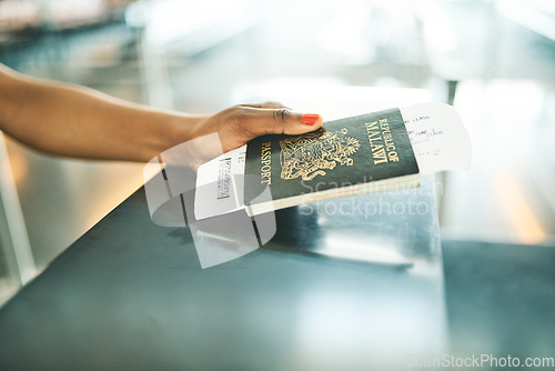 Image of Hand, passport and airport service counter closeup or boarding flight, support and travel desk administration. Travelling tourist, checkin and person with id book, ticket and journey documents