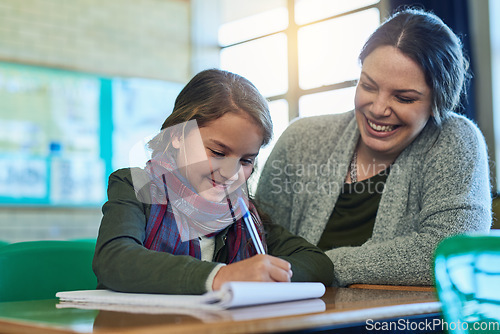 Image of Student, teacher and happy to help with work, study and learning support in math classroom or girl, education and writing in pen. Child, working in book and teaching, helping and motivation in school