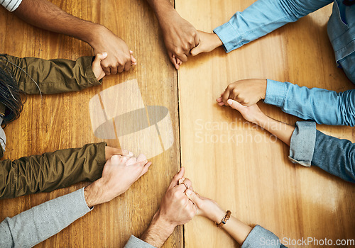 Image of Hands, support and praying people with trust, love and care for religion or spiritual connection as a group or team. Above, community and christian family doing worship prayer for gratitude