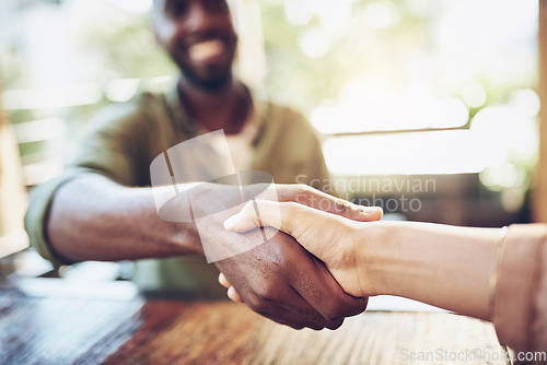 Image of Shaking hands, people and coffee shop with remote work deal and thank you hand sign. Diversity, cafe and restaurant with business partnership, meeting and greeting with handshake for freelancer