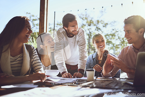 Image of Business, team and group in a meeting at a cafe, planning or brainstorming with conversation, partnership or collaboration. Staff, creative or coworkers share ideas, talking or teamwork in restaurant