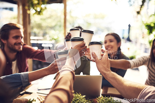 Image of Collaboration, cheers and team with coffee in a meeting or discussion for a creative project in a cafe. Diversity, team building and professional employees with a latte for a toast in a restaurant.