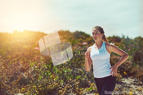 Image of Woman running in nature, fitness outdoor with cardio and training for marathon with young athlete and sports. Female runner in bush, sunshine and run for exercise with healthy person and mockup space