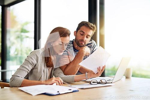 Image of Finance, documents and couple planning budget for tax, bills and savings on laptop with banking, online payment and investment. People, paperwork and conversation on household financial strategy
