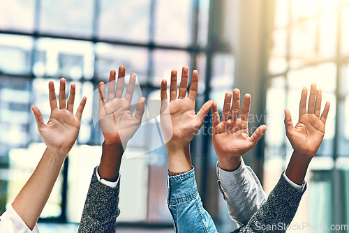 Image of People, diversity and palm group hands in a office meeting with community and at work. Collaboration, teamwork and solidarity of staff with arms and hand raised in a workplace with company team